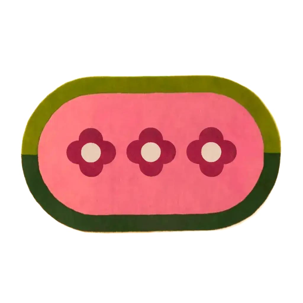 Top view of a unique oval area rug featuring three red flowers on a pink background, bordered by shades of green. This hand-tufted wool rug adds a vibrant touch to any living room, perfect for enhancing your home decor with stylish living room area rugs.