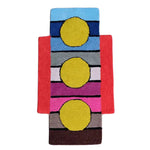 Vibrant hand-tufted wool area rug featuring a modern design with three large yellow circles against colorful horizontal stripes. Perfect for adding a pop of color to large living room spaces, this vintage-inspired rug showcases a unique blend of blue, pink, and red tones, ideal for those seeking stylish large area rugs for their living room.