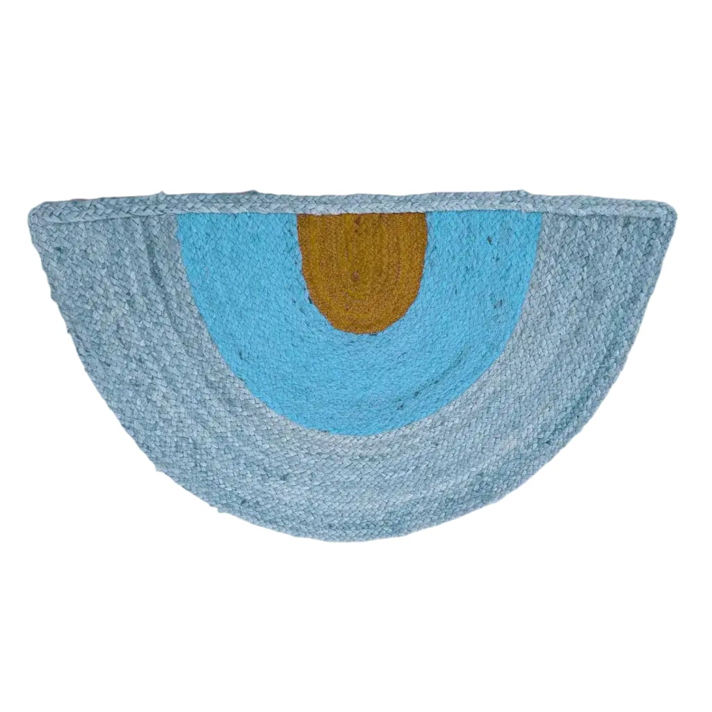 A stylish Three-toned Half Moon Accent Jute Rug with a unique blend of blue and earthy tones. Perfect for large living room spaces, dining areas, or as a boho rug centerpiece. This round jute rug adds a cozy touch to any living room area.