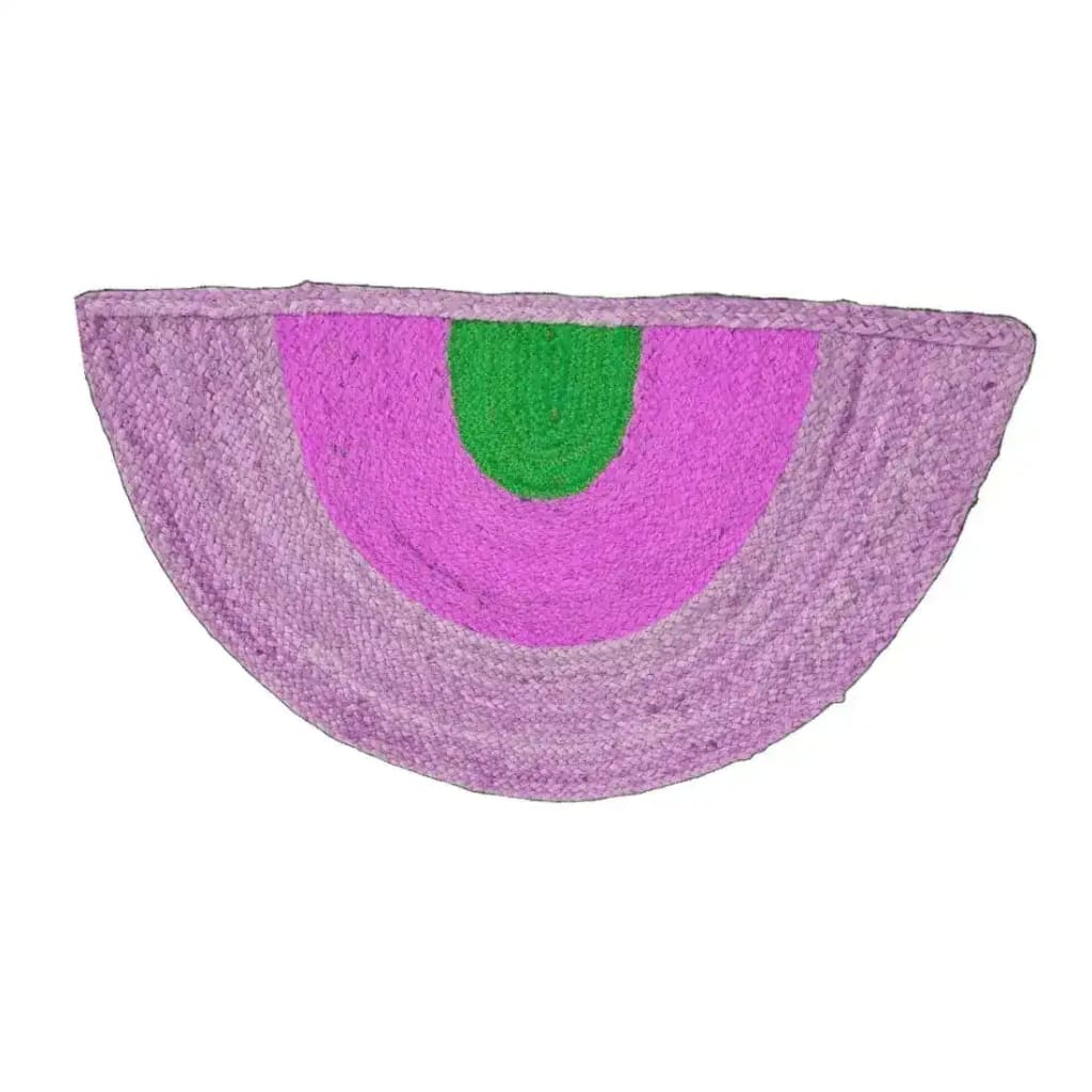A vibrant Three-toned Half Moon Accent Jute Rug featuring pink and green hues, perfect for adding a boho touch to your dining room or bedroom. This round area rug is ideal as a dining table rug, bringing texture and style to your space.