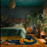 Beautiful Tibetan Tapestry Tufted Wool Rug in a cozy bedroom setting, showcasing an abstract design. This contemporary area rug adds warmth and style to the large living room or office space. Perfect for those seeking a luxurious wool rug to enhance their decor.