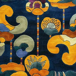 Vibrant Tibetan Tapestry Tufted Wool Rug featuring an abstract floral design with bold colors on a deep blue background. Perfect as a large living room rug or contemporary wool rug for an office setting, adding style and warmth to any space.