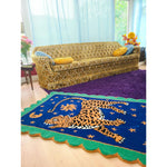 A vibrant Tibetan Tiger Starry Night Scallop Hand Tufted Wool Rug placed in a cozy living room. The area rug features a striking tiger design in rich colors, perfect for large living room rugs or as a vintage rug accent. The plush wool rug complements the eclectic decor, adding warmth and texture to the space. Ideal for use as kitchen rugs, bathroom runner rugs, or hallway runner rugs, this versatile piece fits perfectly in living room rugs 8x10 settings.