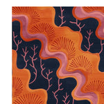 Close-up view of the Tidal Bloom Hand Knotted Rug showcasing its intricate design. This contemporary area rug features vibrant orange patterns resembling coral reefs against a deep navy background, perfect for adding a stylish touch to any living room. Ideal as an 8x10 wool rug for modern interiors.
