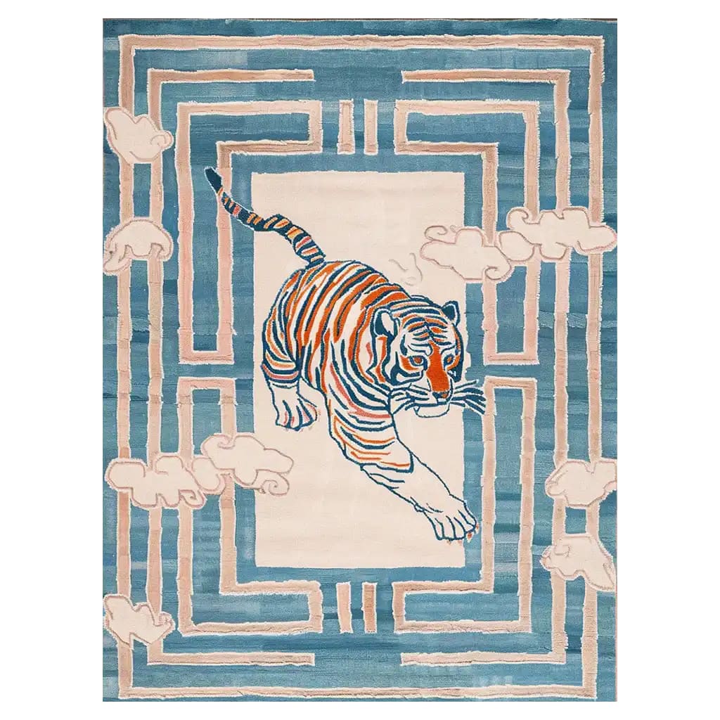 A vibrant Tiger Blossom Canopy Hand Tufted Wool Rug featuring an abstract tiger design in the center, surrounded by soft blue and cream geometric patterns. Perfect as a centerpiece in large living room rugs, this area rug for living rooms blends art and comfort in a wool rug.