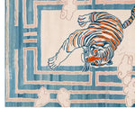 This vibrant area rug features a striking abstract design of a tiger in shades of orange and blue, perfect for large living room spaces. The hand-tufted wool construction adds a luxurious feel, making it an ideal choice for area rugs for living rooms.