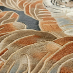 Close-up of a textured rug with circular patterns in earthy tones.