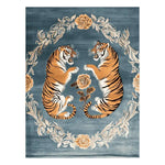 The Tiger's Grace Hand Tufted Rug features an exquisite design with two majestic tigers surrounded by floral patterns on a rich blue background. This wool area rug is perfect for large living rooms, offering a vintage touch with its detailed and elegant floral motifs, ideal as an area rug for living room decor.