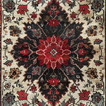 A beautifully detailed Timeless Floral Medley hand-knotted wool rug featuring an intricate floral pattern in rich red, black, and cream tones. This Persian-inspired vintage rug is perfect for enhancing the elegance of any living room or office space. Ideal as an 8x10 area rug, it brings a touch of warmth and sophistication to your decor.