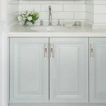 Timeless Glam Shell Cabinet Knobs crystal-embellished silver bar pulls on gray paneled bathroom vanity cabinet