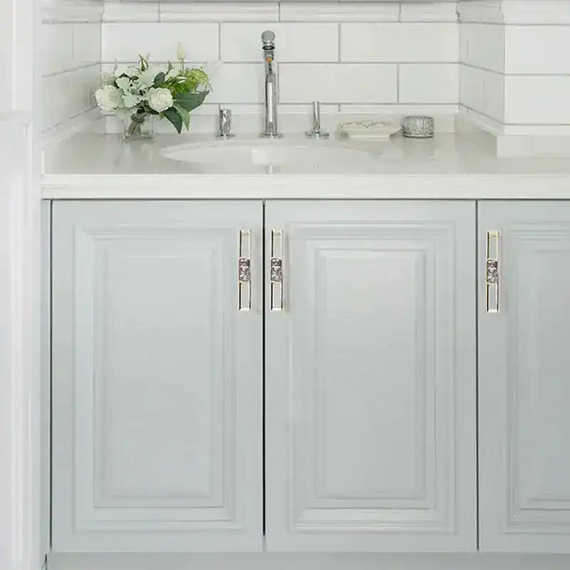 Timeless Glam Shell Cabinet Knobs crystal-embellished silver bar pulls on gray paneled bathroom vanity cabinet