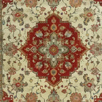 Top view of the Timeless Petals Hand Knotted Area Rug, featuring an intricate Persian design with a bold red central medallion surrounded by detailed floral patterns. Perfect for dining rooms, this wool rug adds a vintage charm to any space, ideal as a large square area rug or dining room carpet.