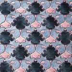 A detailed view of the Timeless Symmetry Hand Tufted Area Rug, showcasing an elegant pattern in shades of blue and pink. Ideal for a contemporary living room, this wool rug adds a touch of vintage charm. Perfect as an 8x10 rug for living spaces, it blends classic and modern designs seamlessly.