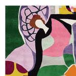 A vibrant, abstract design on a hand-tufted area rug, featuring a mix of bold colors like green, pink, and purple. This contemporary wool rug is perfect for adding a pop of color to large living room spaces, showcasing intricate patterns and dynamic shapes.