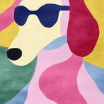Vibrant hand-tufted area rug, featuring a playful abstract design of a dog with sunglasses in bold colors. Perfect for adding a contemporary touch to large living rooms, this wool rug combines style and comfort for the ultimate chic look.