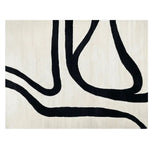 Trace Lines Hand Tufted Area Rug featuring a modern abstract design with bold black lines on a soft cream background. Ideal for enhancing the aesthetics of your living room, this contemporary wool rug combines style with comfort.