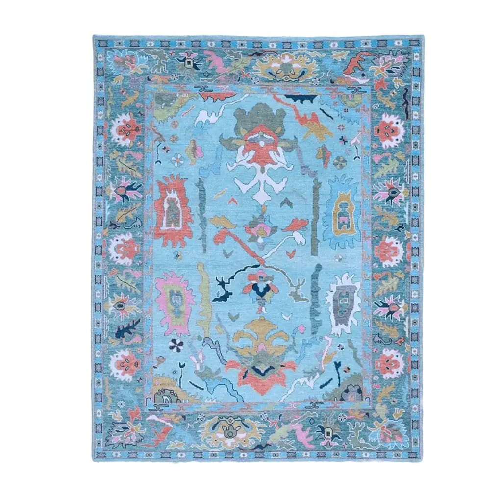 A beautiful traditional floral hand-tufted wool area rug in blue, perfect for enhancing the elegance of any living room. This exquisite rug features a vibrant floral design with intricate patterns, making it an ideal choice for those seeking stylish rugs for living room spaces.
