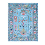 A beautiful traditional floral hand-tufted wool area rug in blue, perfect for enhancing the elegance of any living room. This exquisite rug features a vibrant floral design with intricate patterns, making it an ideal choice for those seeking stylish rugs for living room spaces.