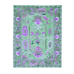 Top view of a Traditional Floral Hand Tufted Wool Rug in green, featuring intricate floral patterns ideal for enhancing living room decor. Perfect as an 8x10 area rug, this wool rug blends traditional design with modern aesthetics, making it a standout piece in area rugs for living rooms.