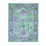 Top view of a Traditional Floral Hand Tufted Wool Rug in green, featuring intricate floral patterns ideal for enhancing living room decor. Perfect as an 8x10 area rug, this wool rug blends traditional design with modern aesthetics, making it a standout piece in area rugs for living rooms.