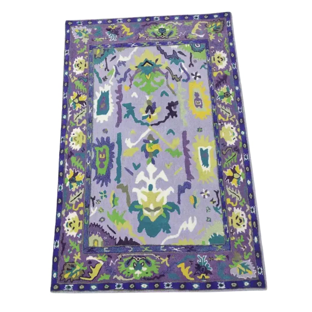 Elegant Traditional Floral Hand Tufted Wool Area Rug in Purple, featuring a vibrant floral pattern, perfect for enhancing your living room or office space. This luxurious wool rug combines style and comfort, making it an ideal choice for rugs in any living room or office setting.