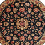 This image features a beautifully detailed Traditional Whirl Hand Tufted Round Area Rug, showcasing intricate floral patterns in rich, warm tones. The wool rug's vintage design makes it a perfect fit for bedroom rugs or any large area rugs needed in a bedroom setting. The elegant round rug embodies a sophisticated touch, ideal for those seeking rugs for bedroom spaces with a hint of floral charm.