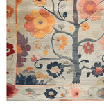 Close-up of the Tree of Vibrant Blooms Hand Tufted Area Rug showcasing intricate floral patterns in warm hues. Perfect for adding a touch of nature to your living room, this wool rug combines elegance with comfort, making it an ideal choice for those seeking floral rugs and living room area rugs.