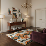 Tribal Tapestry rug with orange and gold medallions on green and cream in a refined living room
