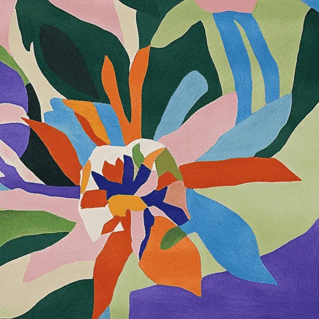 A vibrant area rug showcasing an abstract floral design with bold colors, perfect for contemporary living rooms. This hand-tufted wool rug features a square shape, combining elements of green, blue, orange, and pink in a lively pattern, ideal for adding a pop of color to any space.