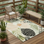 Decorative outdoor rug with leaf patterns on a wooden deck with plants and furniture.