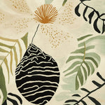 Close-up view of the Tropical Garden Whispers Hand Tufted Rug, showcasing an abstract floral and leaf pattern in earthy tones. This contemporary area rug is perfect for large living rooms, adding a touch of elegance with its intricate wool design.