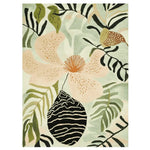 Decorative outdoor rug with leaf patterns on a wooden deck with plants and furniture.
