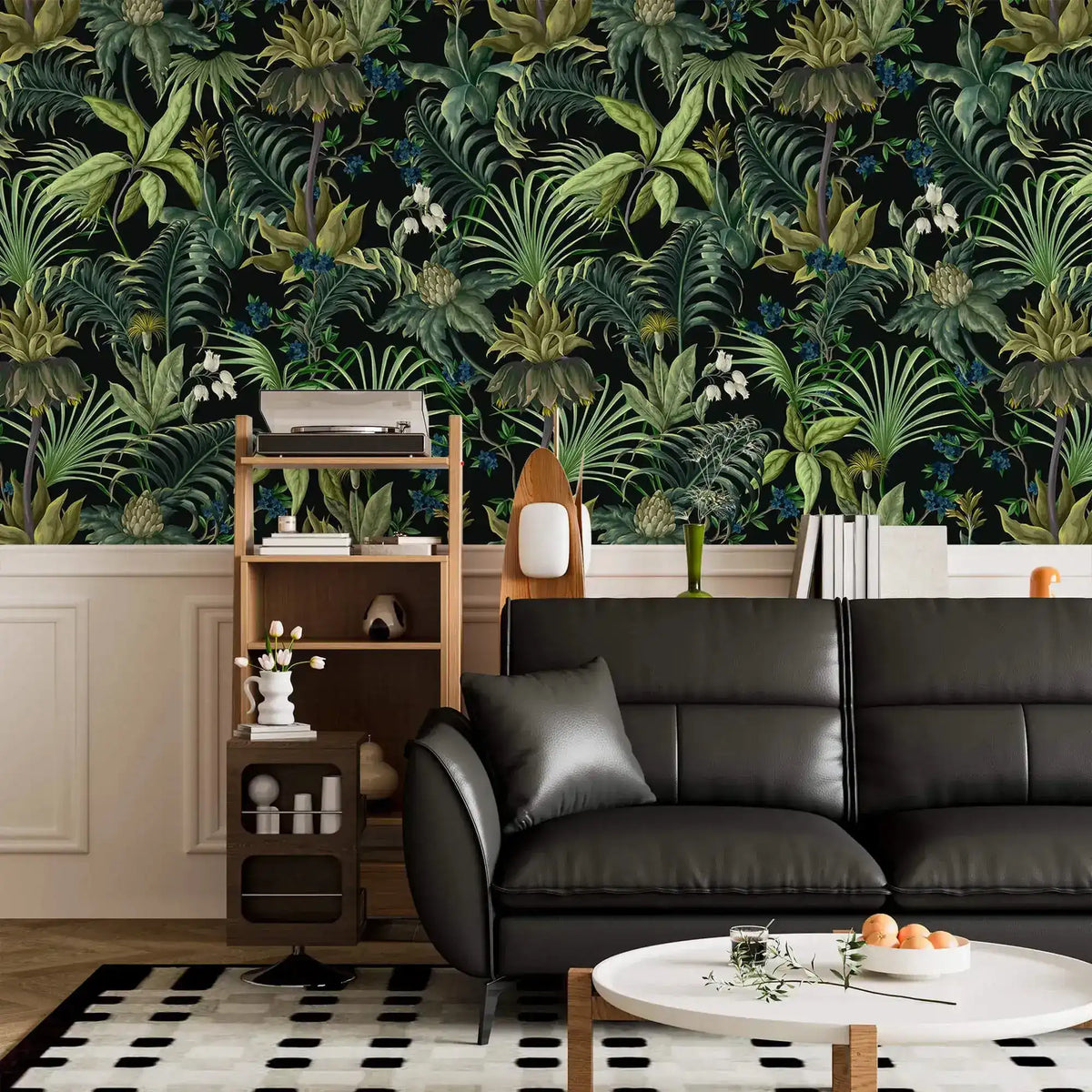 Tropical jungle canopy wallpaper above white wainscot with black leather sofa and ladder shelf