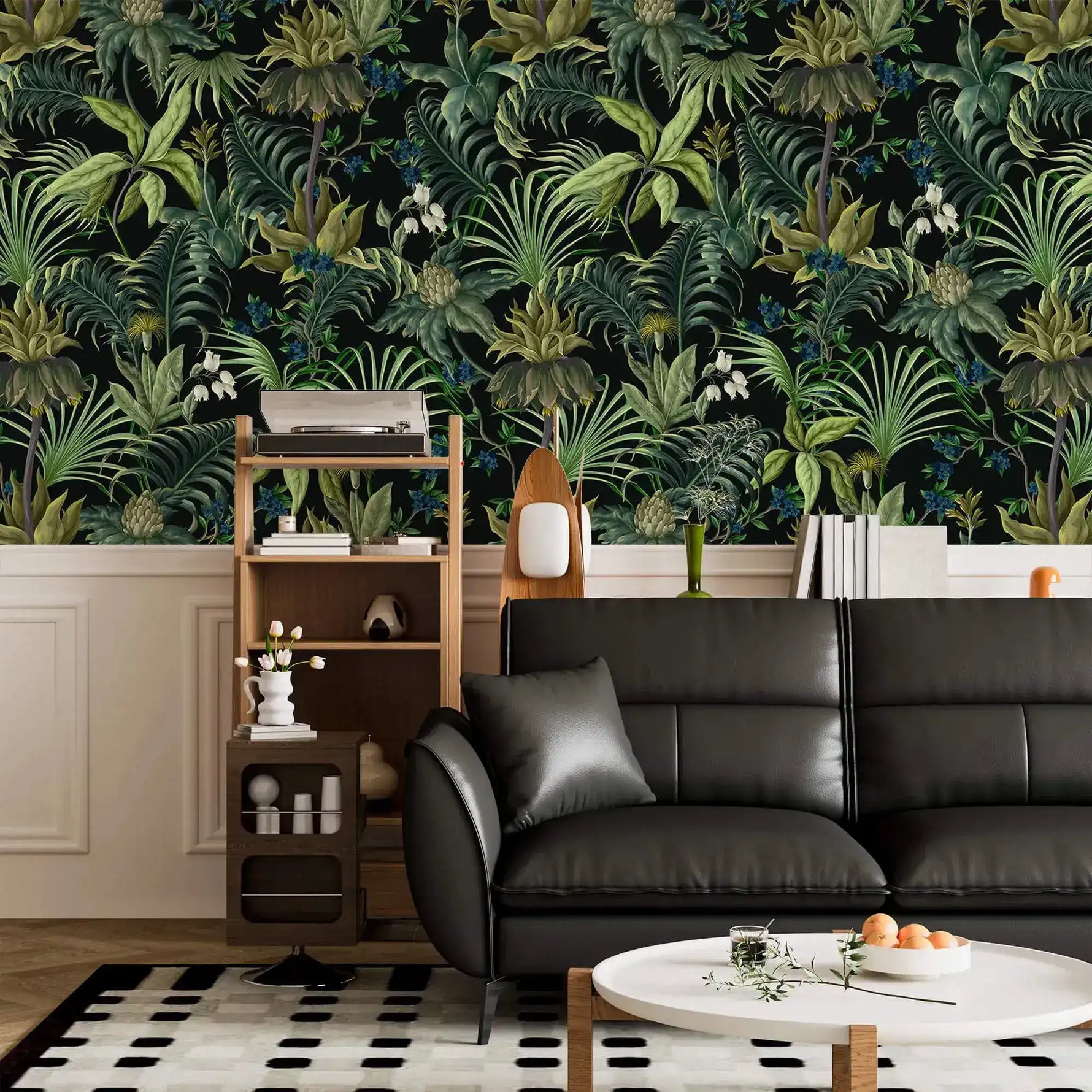 Tropical jungle canopy wallpaper above white wainscot with black leather sofa and ladder shelf