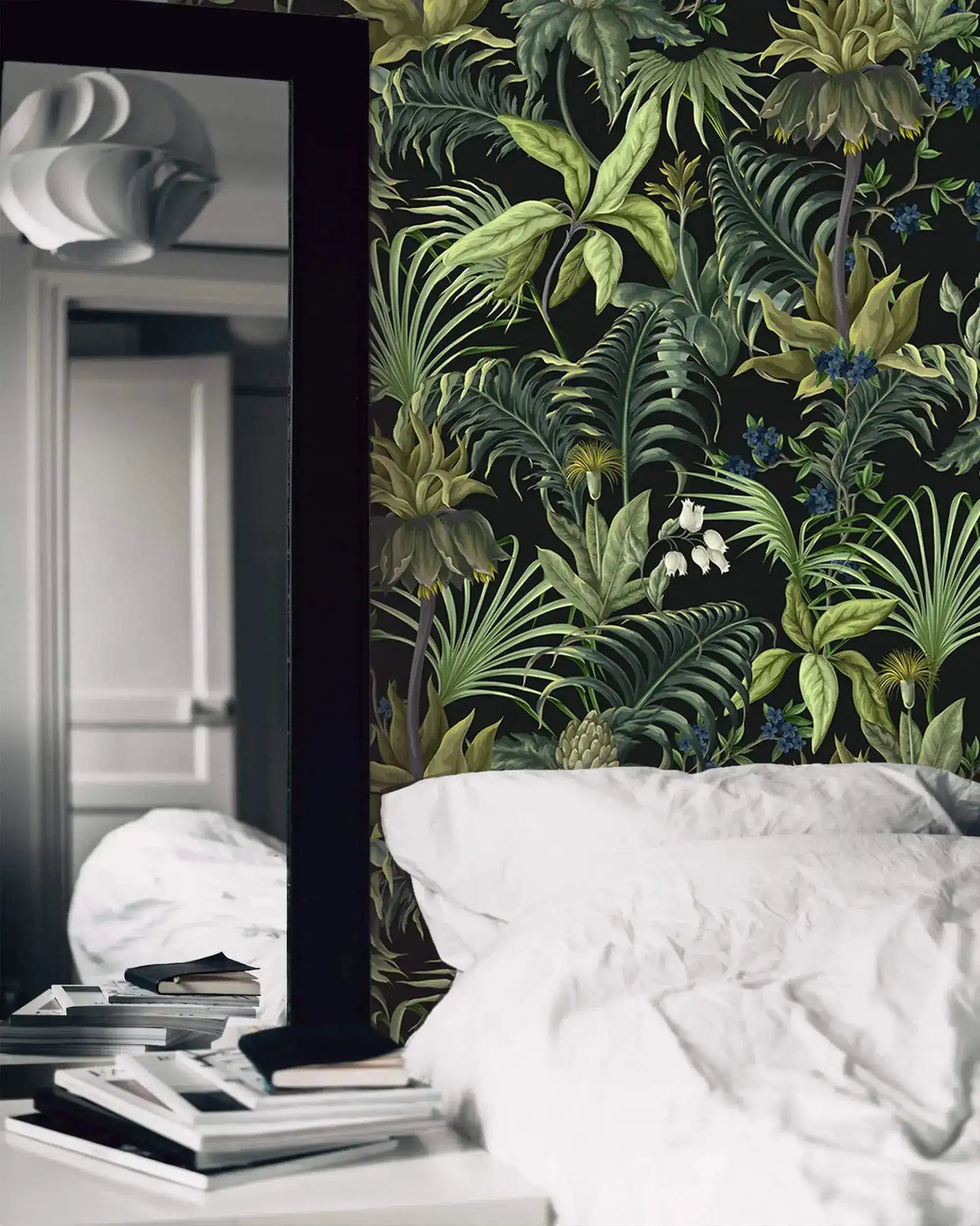 Tropical jungle canopy wallpaper in bedroom with white bedding and leaning floor mirror