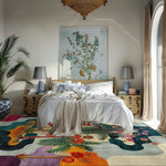Tropical Oasis rug with vivid flowers, ferns and birds under a bed in a serene neutral bedroom