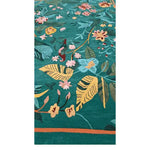 Vibrant Tropical Treasure Hand Tufted Wool Rug, perfect for large living room spaces. This 4 x 6 ft area rug features a lush floral design with vivid green, yellow, and pink hues, adding a touch of nature-inspired elegance to your living room decor.