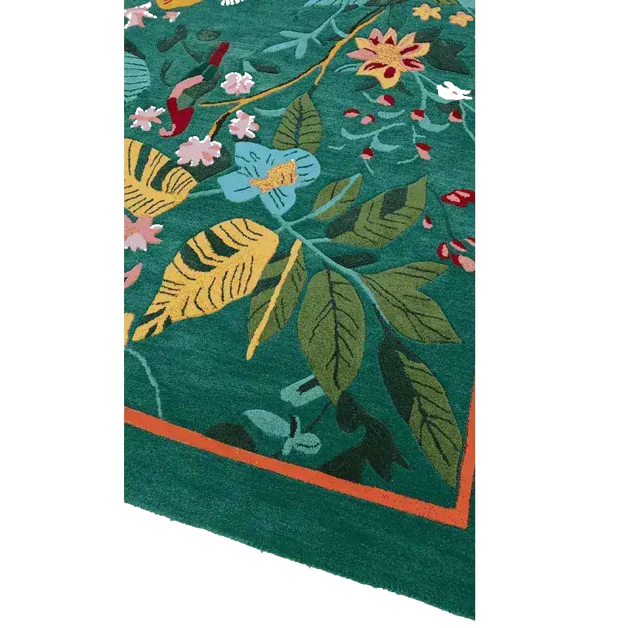 Close-up view of the Tropical Treasure Hand Tufted Wool Rug, showcasing a vibrant floral design. This 4 x 6 ft area rug, perfect for large living room spaces, features lush green tones with colorful floral patterns, making it an ideal wool rug for enhancing the aesthetic of any living room. The intricate details of this floral rug are highlighted in the image, offering a glimpse into its craftsmanship.