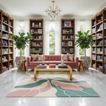 Living room with pink sofa, bookshelves, and a colorful rug.
