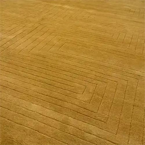 This image features the Turmeric Artic Geo Modern Hand Tufted Wool Rug, a large area rug perfect for contemporary living rooms. The wool rug displays an intricate geometric pattern in a warm turmeric hue, showcasing its modern design and high-quality craftsmanship.