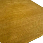 The image showcases a Turmeric Artic Geo Modern Hand Tufted Wool Rug, perfect for those seeking a contemporary rug. This large area rug, measuring 9 x 12, features a geometric pattern that adds a modern touch to any living room decor.