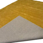 Top view of the Turmeric Artic Geo Modern Hand Tufted Wool Rug, showcasing its contemporary design. This large area rug, ideal for living rooms, features a geometric pattern in a vibrant turmeric color, adding a stylish touch to any space.