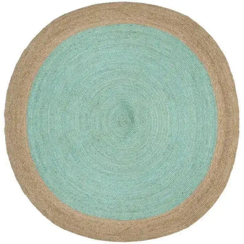 A beautifully crafted turquoise round jute rug, perfect for adding a touch of elegance to your dining room or living room. This area rug features a soothing turquoise center with a natural jute border, making it an ideal choice for dining room area rugs or as a stylish addition to area rugs for living room spaces.