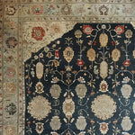 A beautifully intricate Turquoise Tradition Hand Knotted Area Rug, showcasing a rich floral design with Persian rug influences. This large living room rug features a vintage aesthetic with detailed patterns in warm tones, ideal for adding elegance to any space.