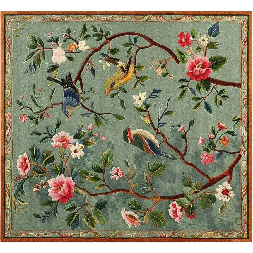 The Twilight Branches Hand Tufted Rug is a stunning wool area rug featuring a vibrant floral design with branches and birds, perfect for adding elegance to a dining room or formal setting. This large square rug showcases intricate details, making it an ideal choice for large area rugs in living rooms.