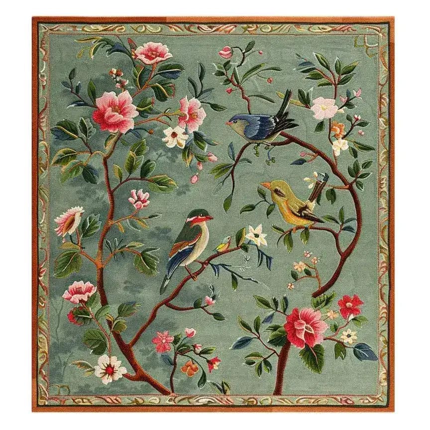The Twilight Branches Hand Tufted Rug showcases a vibrant floral design with birds perched among branches, perfect for adding charm to a dining room. This wool rug is a square area rug, ideal for large living spaces and formal dining rooms. The intricate floral pattern makes it a standout piece among large area rugs.