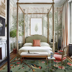 Elegant dining room featuring a Twilight Branches Hand Tufted Area Rug. This wool rug, with its intricate floral design, adds a touch of sophistication to the formal dining room. The large square area rug enhances the space, making it ideal for both dining and living room settings.