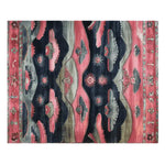 Top view of the Twilight Horizons Hand Tufted Rug, a stunning area rug showcasing a vibrant mix of reds, blues, and grays in an abstract pattern. Perfect for adding a touch of elegance to any living room, this vintage-inspired wool rug offers a unique blend of traditional and modern design elements.