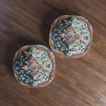 Two Ornate Floral and Geometric Floor Pillows with split dark-teal and sage floral panels placed on dark walnut hardwood floor, overhead view