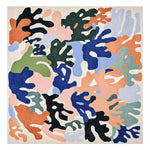 Vibrantly colored abstract pattern on a square area rug made from wool. Ideal for contemporary living room spaces, this hand-tufted rug combines bold hues of orange, blue, green, and black, creating a modern artistic flair.